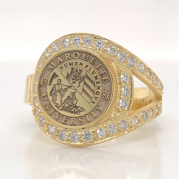 14k Gold College Ring, University Ring , Graduation Gift , Graduation Ring , Woman Ring , Signet Rİng, Chiristmas Gift, Woman Class Rings This product is GUARANTEED for life. - College graduation rings for men and women delicately engraved with your school logo or any other initials or image you want. - The ring has solid back. Deep and detailed engraving very delicately handcrafted unisex - looks super cool on both women & men - The ring is 925 Silver - Please contact me for your 14 carat and 1 Halo Ring Jewelry Gift, Halo Ring Jewelry For Gift, Gift Engraved Ring With Halo Setting, Gold Jewelry With Halo Setting As Gift, Gold Cluster Ring With Halo Setting And Open Design, Oval 14k Stamped Commemorative Rings, Oval 14k Stamped Commemoration Ring, Fine Jewelry Engraved Ring With Prong Setting, Gold Cluster Ring With Cubic Zirconia Stamped 14k