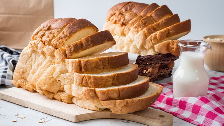 a loaf of bread sitting on top of a cutting board