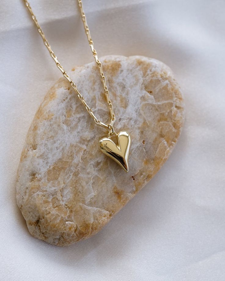 Show your love with this gorgeous Puffy Heart Necklace! Crafted in luxurious gold, this eye-catching necklace adds the perfect touch of romance to your look. For a heartfelt gift or an expression of your own affection, you can't go wrong with this stunning piece! NECKLACE FEATURES Material: Brass 24K Gold Filled Chain Width: Approx. 1.5mm Chain Style: Barleycorn Designed Chain Lead Free, Nickel Free Puffy Heart Necklace, Dainty Heart Necklace, Friendship Necklace, Necklace Love, Friendship Necklaces, Dainty Gold Necklace, Chain Extenders, Puffy Heart, Jewelry Card