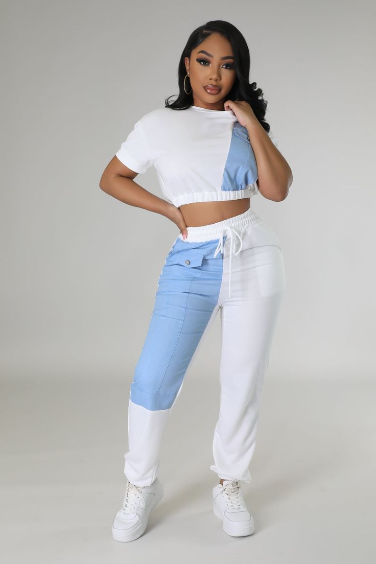 Two piece set Crop top Round neckline Short sleeves Denim detail Elastic waistband No closure High waisted pants Elastic waistband Pockets Denim detail Cuffed bottom No closure 100% cotton Wash warm Inseam is 32 inches Model is wearing a small MODEL STATS Height: 5.3"Bust:33" / Waist:28" / Hips:42" Please see size chart for information on the fit Fitted Blue Cotton Palazzo Set, Blue Streetwear Bottoms With Elastic Waistband, Blue Two-piece Pants Set For Summer, Blue Two-piece Summer Pants Set, Semi-stitched Cotton Blue Palazzo Set, Casual Beach Wear, Denim Details, Shop Swimwear, New Arrival Dress