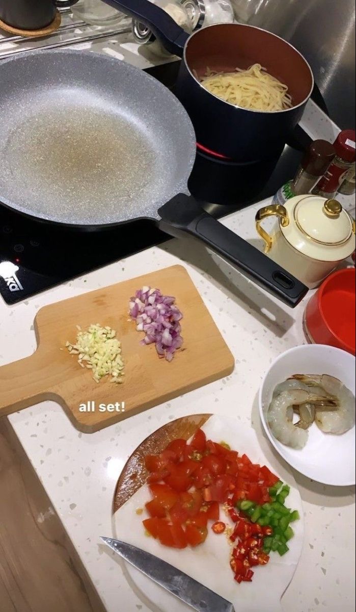 there are many different types of food on the counter top, including pasta and vegetables