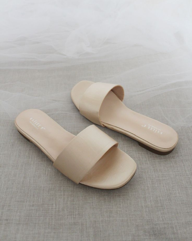 Classic slide flat sandals for casual and dressy look. Simple and easy wear for brides, bridesmaids and wedding parties.DETAILS:COLORS AVAILABLE: Ivory, Light Blue, White, Pink, and ChampagneUPPER: Synthetic upper and liningMATERIALS: Mandmade outsole STYLE NAME: EVELYN Elegant Beige Flats For Summer, Elegant Beige Beach Flats, Elegant Summer Slides With Flat Heel, Elegant Flat Heel Slides For Beach, Beige Summer Formal Flats, Elegant Summer Beach Flats, Chic Wedding Sandals For Summer, Formal Summer Beige Flats, Formal Beige Summer Flats