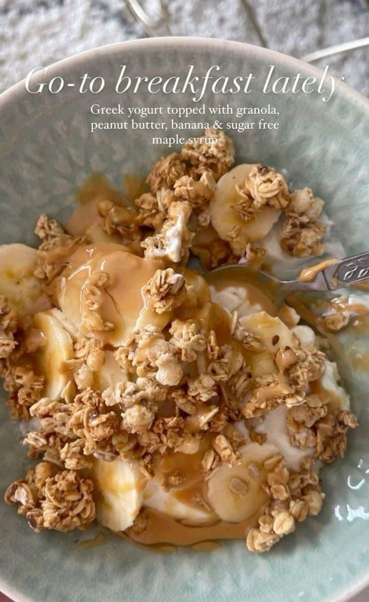 a bowl filled with granola, bananas and yogurt