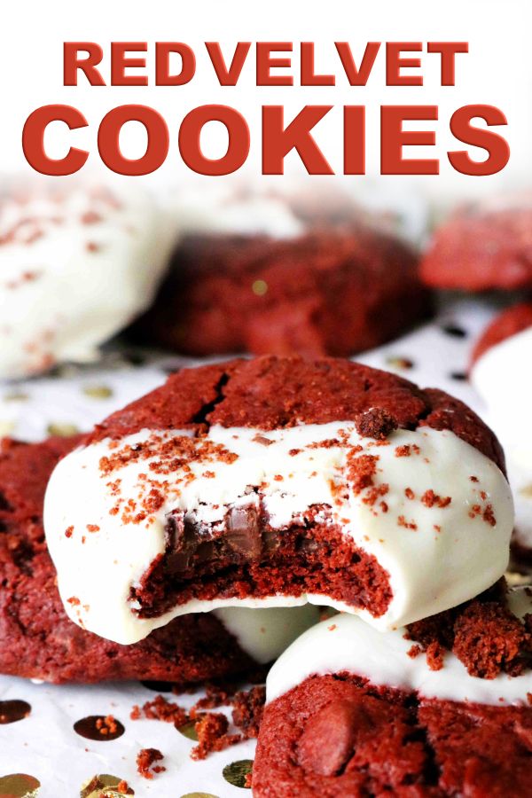 red velvet cookies with white frosting and sprinkles