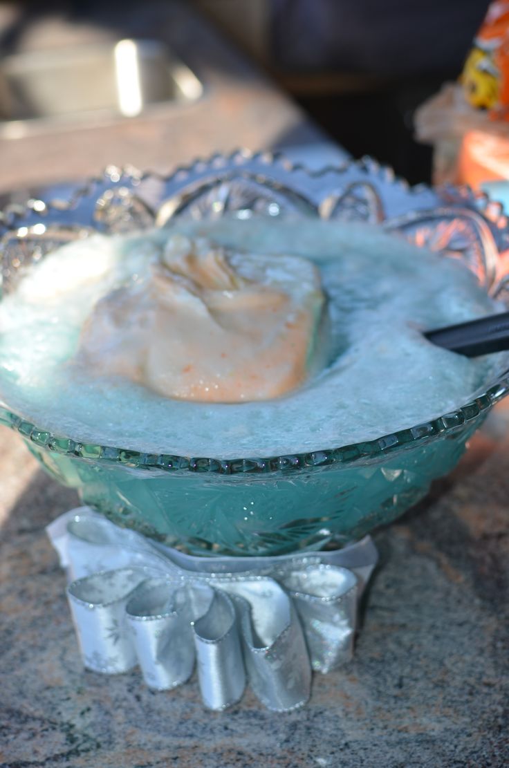 a bowl filled with ice sitting on top of a table