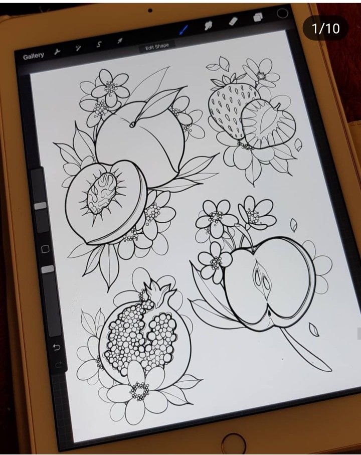 an ipad with some drawings on it and the screen showing fruit in black and white