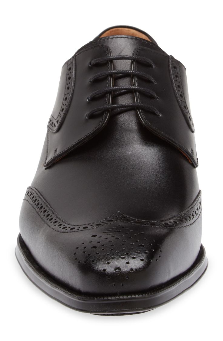 Classic broguing stipples the upper of a burnished-leather derby that adds clean grounding to your sophisticated styles. Lace-up style Cushioned footbed Leather upper and lining/rubber sole Made in Spain Brogue Lace-up Shoes In Calf Leather For Business, Black Oxfords With Perforated Toe Box For Formal Occasions, Black Oxfords With Perforated Toe Box For Formal Wear, Black Formal Oxfords With Perforated Toe Box, Timeless Calf Leather Lace-up Shoes With Brogue Detailing, Formal Black Oxfords With Perforated Toe Box, Black Formal Lace-up Shoes With Perforated Toe Box, Classic Brogue-detailed Semi-formal Oxfords, Classic Wingtip Lace-up Shoes For Derby