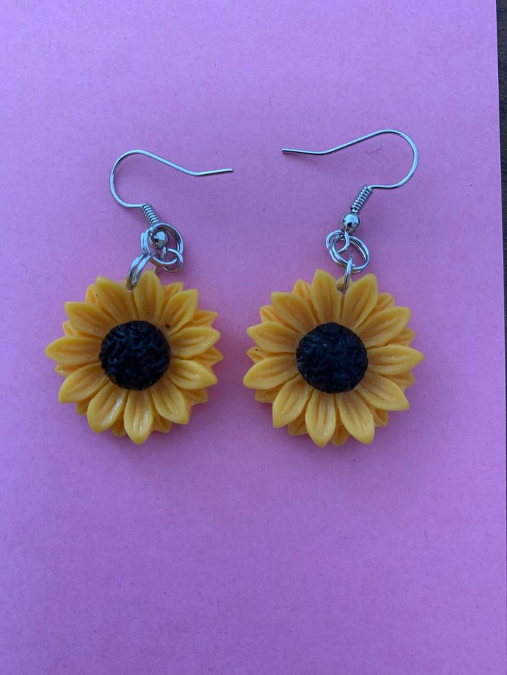 These are handmade sunflower drop earrings. They are lightweight for extended comfortable wear. Yellow Sunflower Dangle Earrings, Yellow Sunflower Design Dangle Earrings, Sunflower Dangle Earrings For Summer, Sunflower Design Dangle Earrings For Gift, Sunflower Design Dangle Earrings As Gift, Summer Sunflower Dangle Earrings, Yellow Sunflower Design Earrings For Summer, Casual Handmade Yellow Earrings, Summer Flower Earrings With Sunflower Design