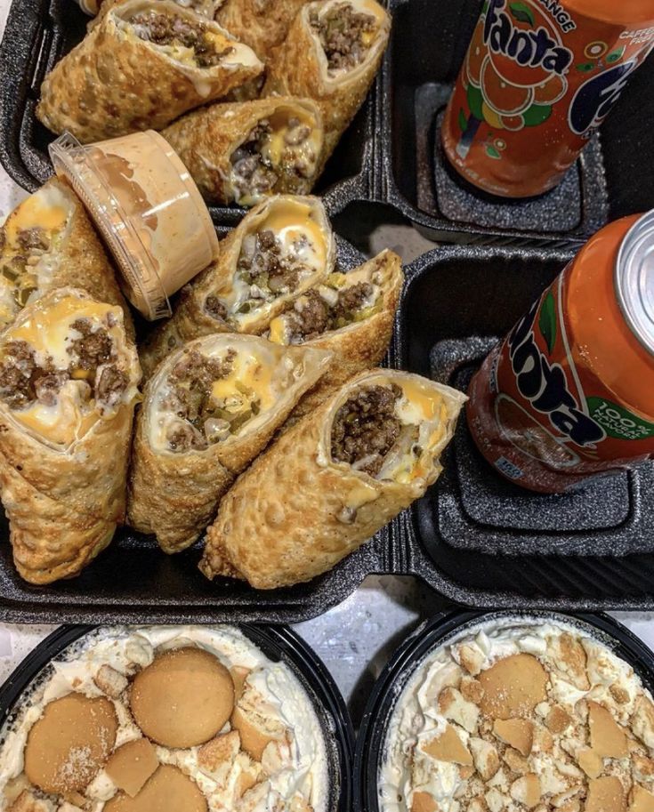 some food is sitting on trays with drinks