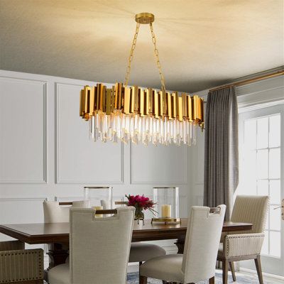 a dining room table with chairs and a chandelier