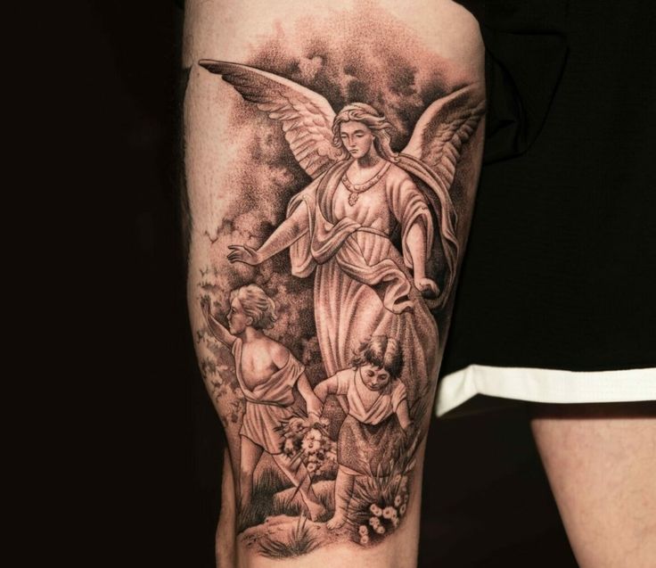 a man with a tattoo on his arm has an angel and two cherubs