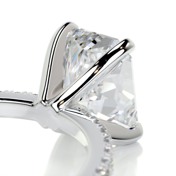 This is why radiant cuts are so popular! They give the most modern twist to classic rectangular cuts.Here is our 2.3-ctw radiant F VS2 engagement ring finished with a band of icy white diamonds.This has her name all over it.2 Carat Radiant F VS2 Diamond with an additional of 0.3 Carat Diamonds on the sides. This Ring is Certified by a Third Party Gemological institute 3 Carat Ring, Special Engagement Ring, Timeless Engagement Ring, Measure Ring Size, 3 Carat Diamond, Vs2 Diamond, Pave Engagement Ring, Types Of Diamonds, Engagement Rings Platinum