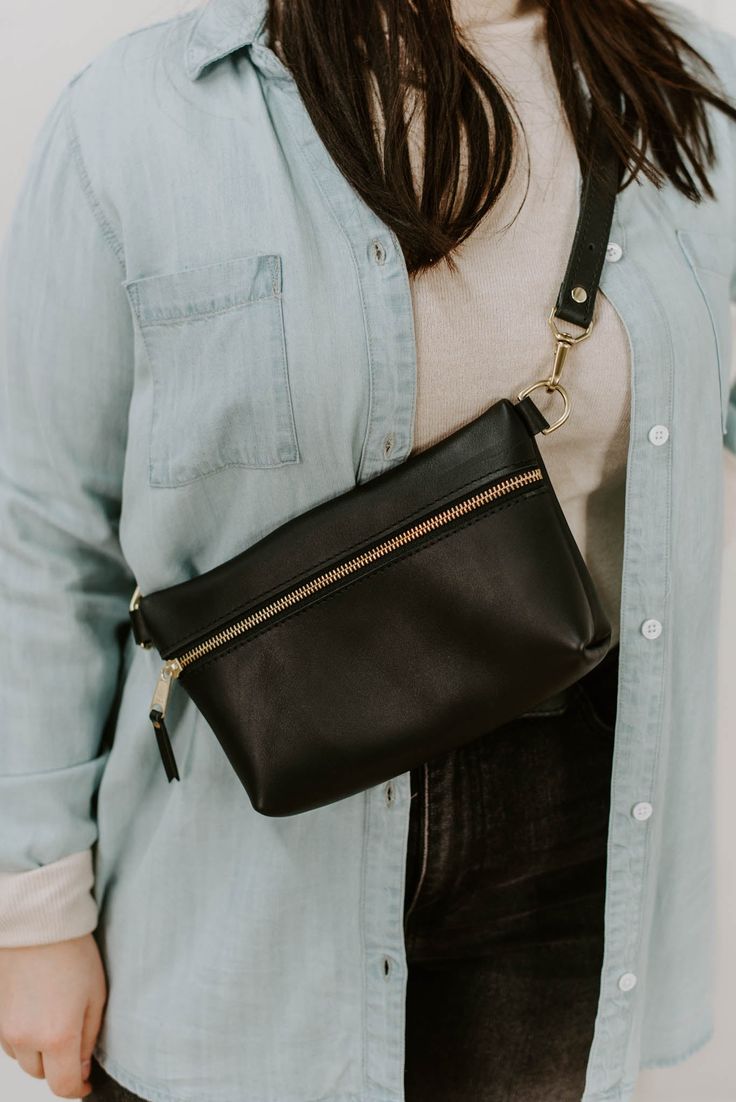 Zelaki Leather Co. Agow Belt Bag Keep things effortless and hands-free with the Agow Belt Bag! Wear it as a crossbody belt bag or fanny pack styles, the Agow is a timeless look full of convenience! Made from full-grain Ethiopian leather this bag will last you a lifetime. Agow Belt Bag Details: Colors: Black, Brown, or Olive Ethically & sustainably made in Ethiopia 6"H x 10"W x 2"D (at widest points) Exterior pocket measurements: 7.5x4.25 inches Strap adjusts from 24-41 inches Zipper closure Bras Fanny Pack Style, Crossbody Belt Bag, Layered Crosses, Baby Pearls, Bag Details, Open Hoop Earrings, Heart Hair, Dressy Dresses, Belt Shop