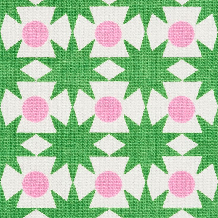 a green and white pattern with pink dots