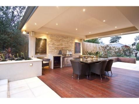 an image of a living room and kitchen in the same house or home that is for sale