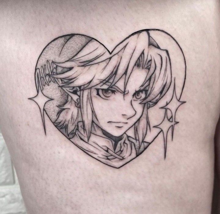 a woman's back with a heart shaped tattoo on her stomach, and an anime character