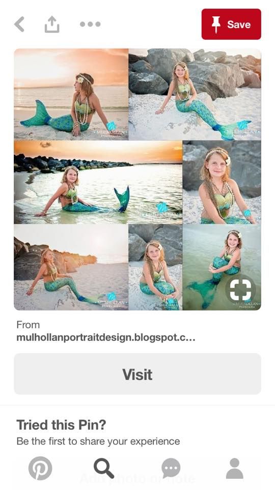 a beautiful young mermaid sitting on the beach in her green and blue outfit, posing for pictures