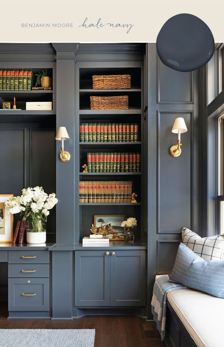 a living room filled with lots of books and furniture