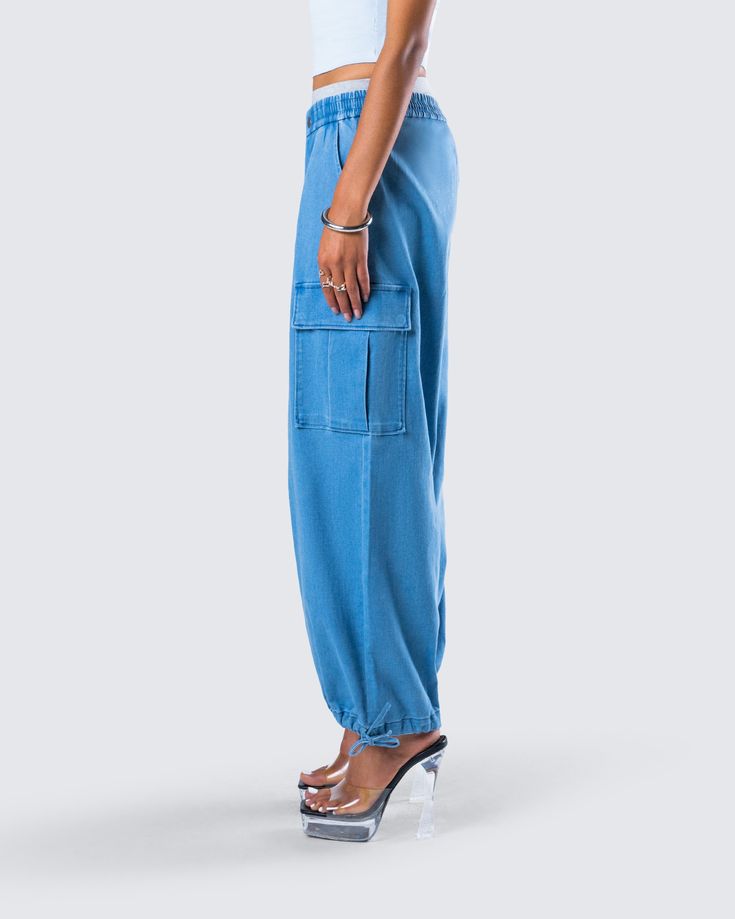 Add a little flare to your closet with these blue denim parachute pants 💙 With a chic yet casual feel, these pants complete with cargo pockets and a smocked waistband are the perfect piece for any occasion where you want to be the best dressed 😚 Streetwear Straight Leg Cargo Jeans With Elastic Waistband, Straight Leg Cargo Jeans With Elastic Waistband For Streetwear, Streetwear Cargo Jeans With Elastic Waistband, Casual Denim Blue Cargo Jeans With Elastic Waistband, Denim Pants With Elastic Waistband For Streetwear, Casual Cargo Jeans With Elastic Waistband, Summer Mid-rise Cargo Parachute Pants, Trendy Cargo Jeans With Elastic Waistband, Summer Full-length Cargo Jeans With Multiple Pockets