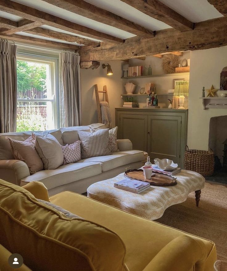 a living room filled with furniture and a fire place