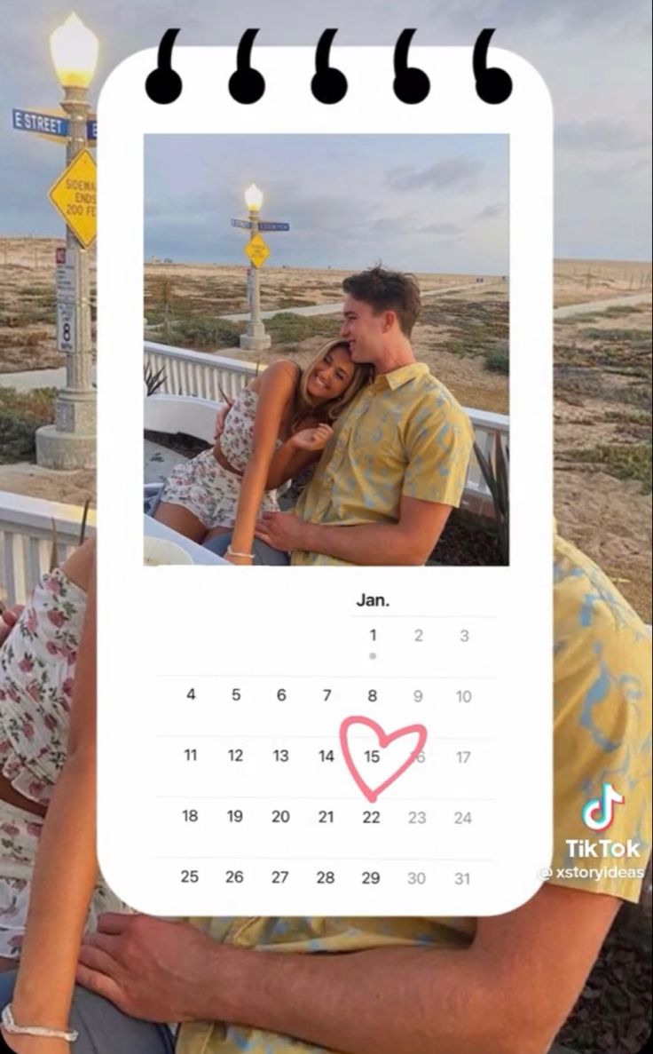 a man and woman sitting on a bench next to each other in front of a calendar