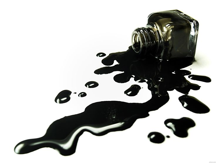 spilled black liquid spilling from a bottle onto the floor