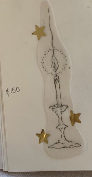 a white card with gold stars on it and a drawing of a fountain in the middle