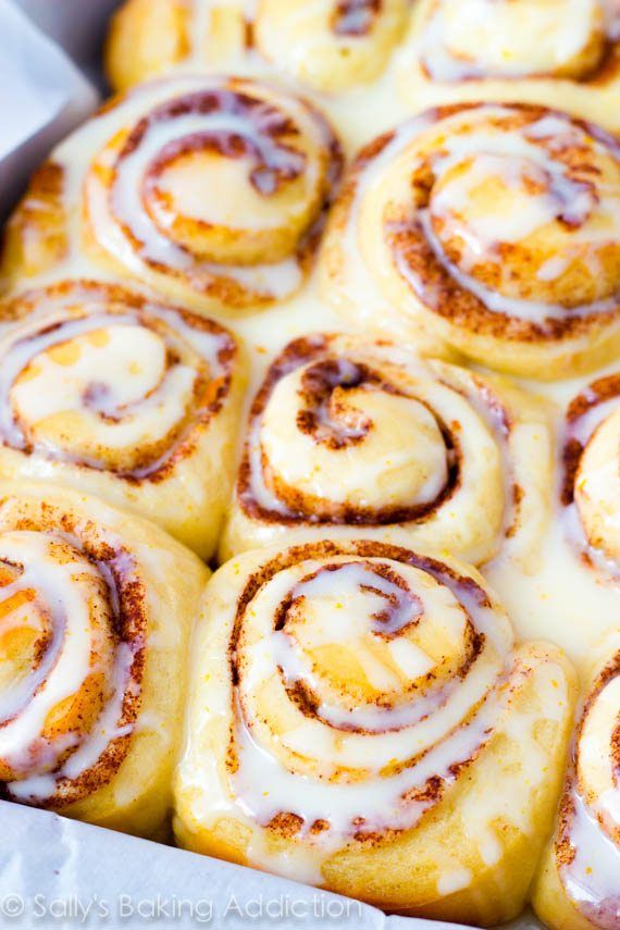 cinnamon rolls in a pan with icing on top