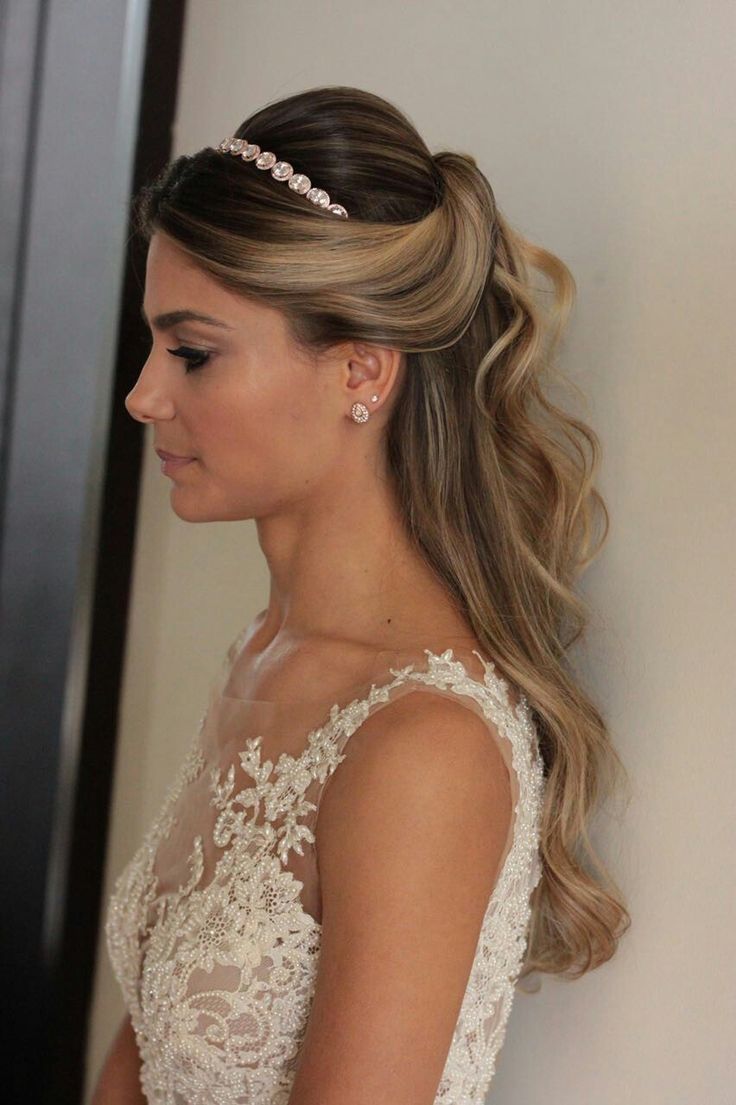 a woman with long hair wearing a wedding dress