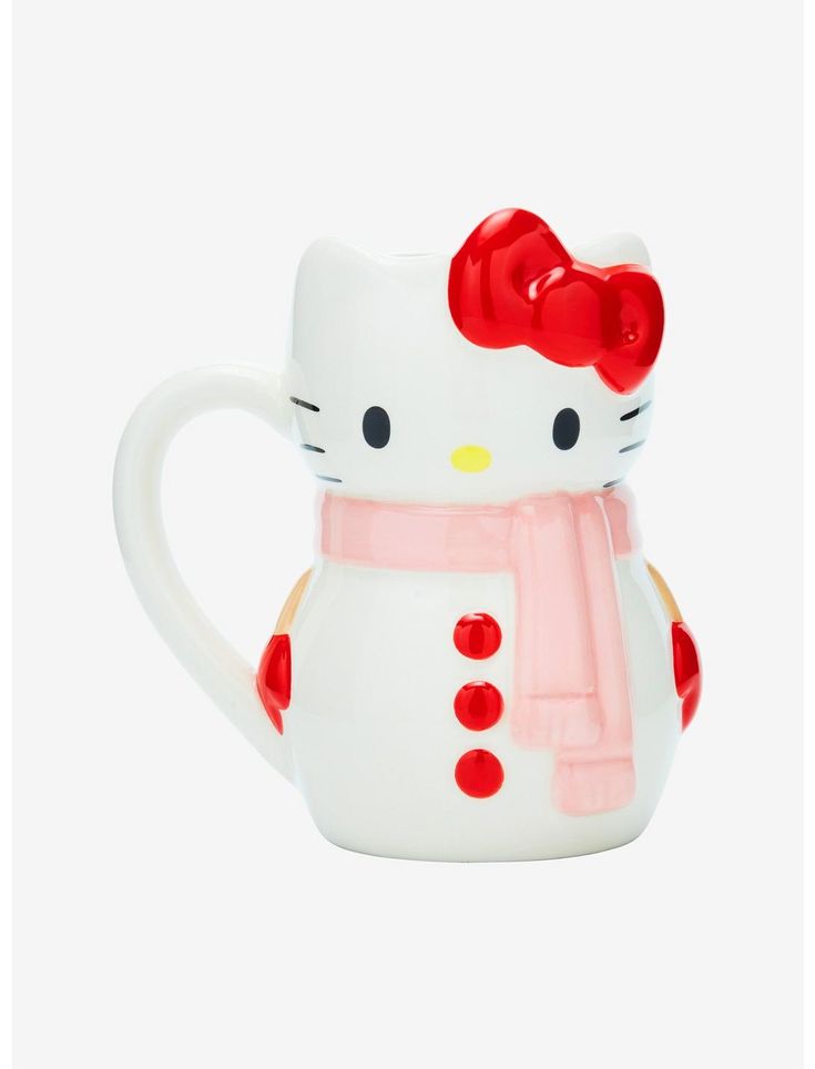 a hello kitty mug with a red bow on it