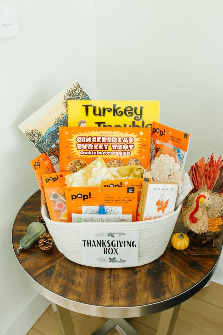 a basket filled with thanksgiving treats sitting on top of a table