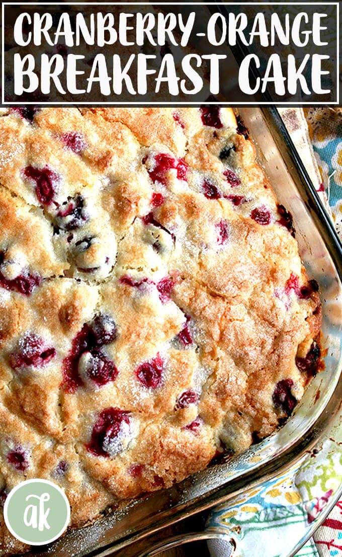 a close up of a cake in a pan with the words cranberry orange breakfast cake