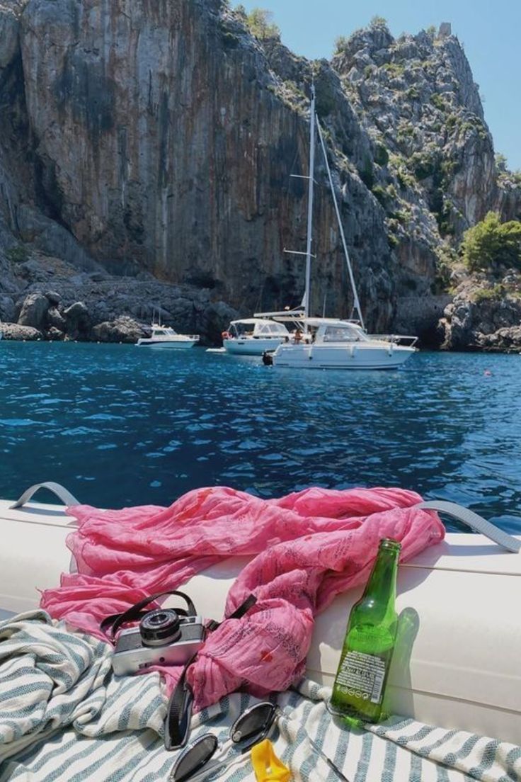 there is a pink blanket on the back of a boat