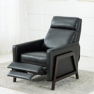 a black recliner chair sitting on top of a rug