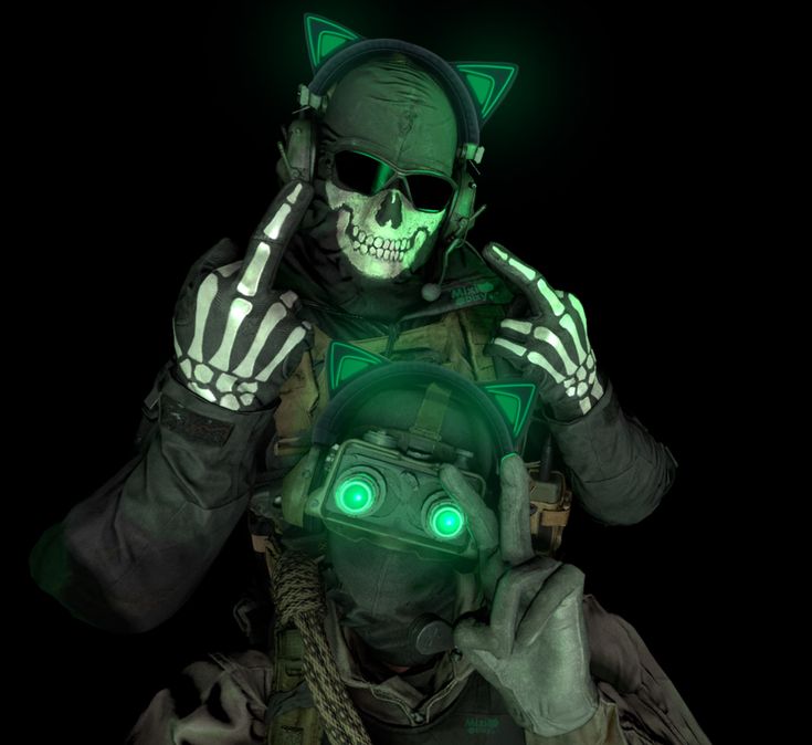 a man with green glowing eyes wearing a cat mask and holding his hand up to his face