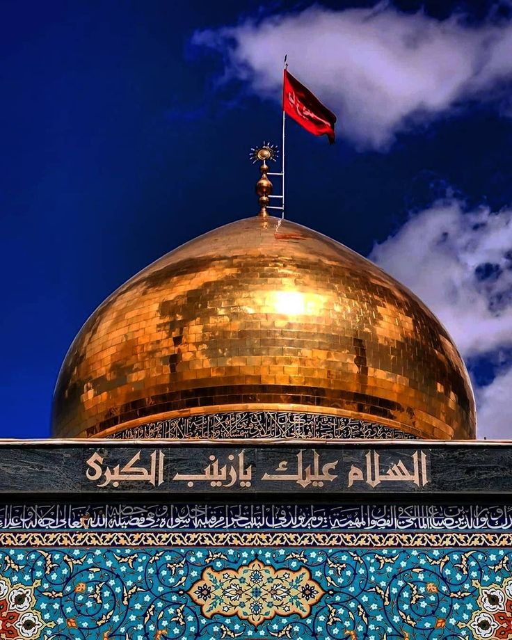 a golden dome on top of a building under a blue sky with clouds in the background