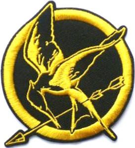 a yellow and black patch with a bird on it