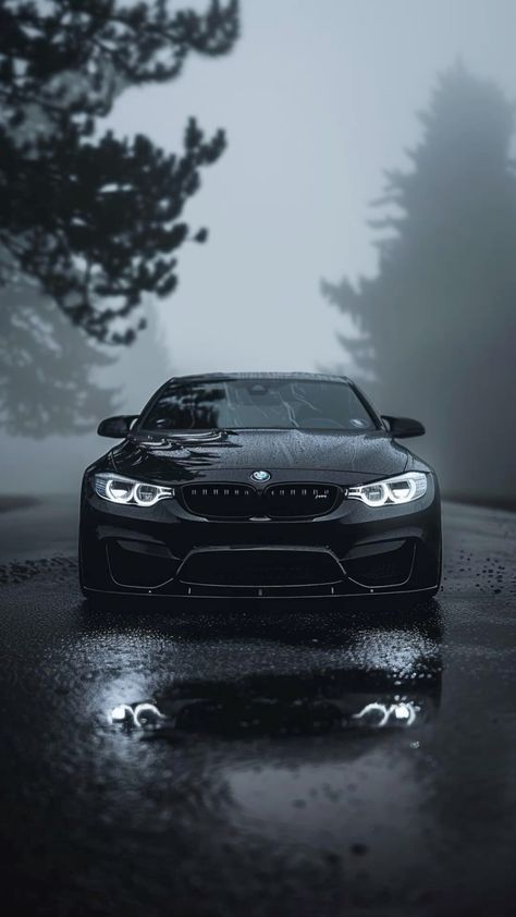 a black sports car parked in the rain