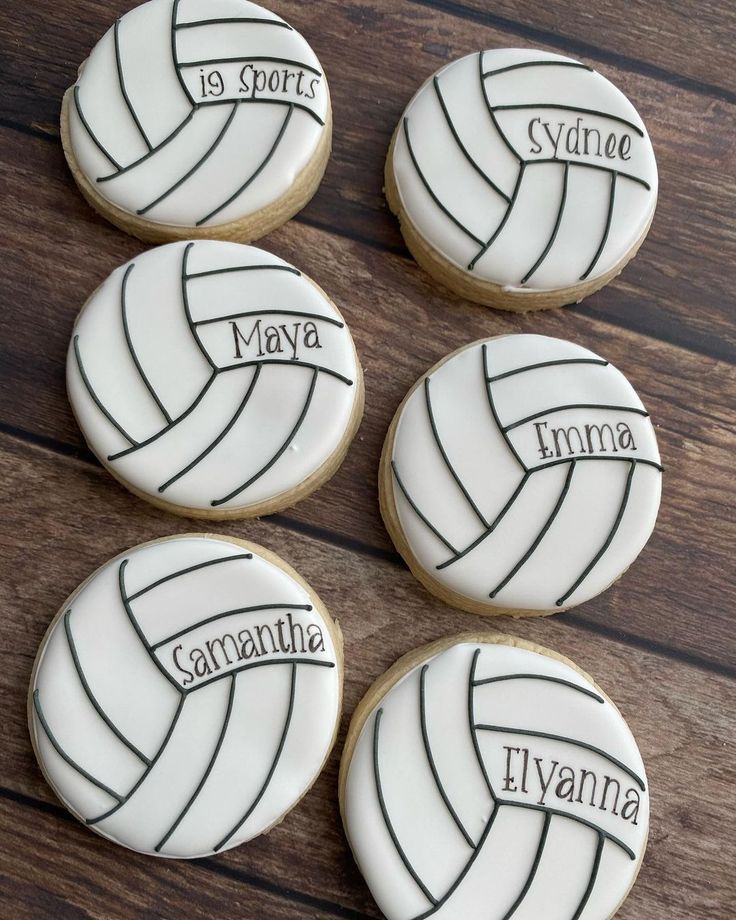 four decorated cookies with the names of volleyball players