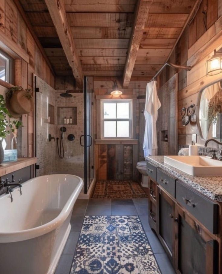 a bathroom with a bathtub, sink and mirror in the middle of it's wood paneled walls