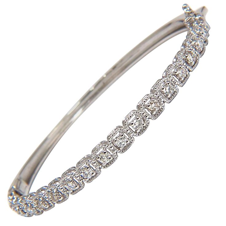 .90ct natural diamonds bangle bracelet Squared rope twist form surrounding each diamond Rounds & Full cut. H-color & Si-1 clarity. 14kt. white gold 11 Grams. 4.6mm wide 6.5 inch (wearable length) Secure Lock, safety catch and snap Dazzling Diamond Bangle Bracelet With Pave Setting, Diamond White Diamond Bangle With Pave Setting, Classic Diamond Pave Bangle Bracelet, Diamond White Pave Bangle Jewelry, Classic Hand Set Diamond Bangle, Classic Hand Set Diamond Bangle Bracelet, Classic Jewelry Bangle With Single Cut Diamonds, Dazzling Pave Setting Bangle Bracelet, 17 Jewels Bangle Diamond Bracelet For Anniversary