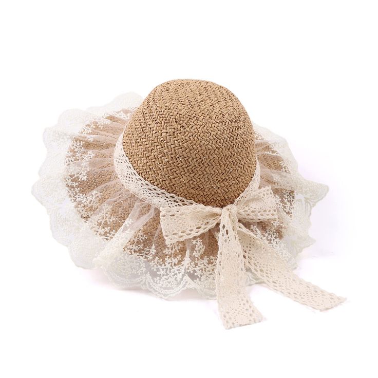 a hat with white lace around it and a bow on the brimmed top