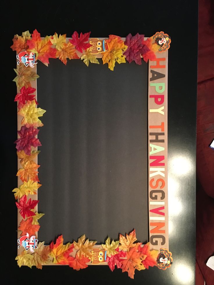 a photo frame decorated with fall leaves and the words happy thanksgiving