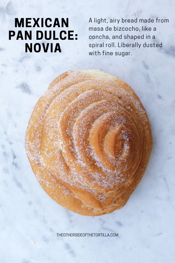 an advertisement for mexican pan dulce novia on a marble countertop with powdered sugar