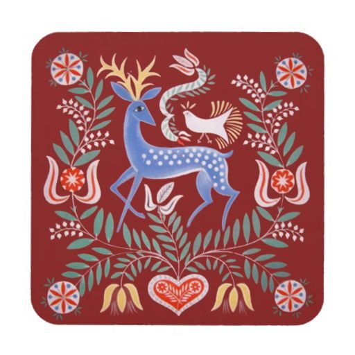 a red coaster with an image of a deer and flowers