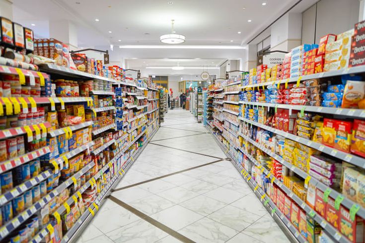 an aisle in a grocery store filled with lots of food