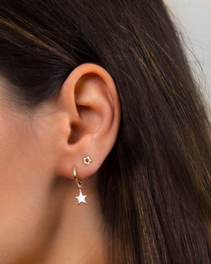 "An everyday go-to pair of huggie hoops. Simple, dainty and classy, these little star hoops are perfect for wearing stacked with other dainty hoops and studs. * Sold as a Pair * D E T A I L S * ∙ Material: .925 Sterling Silver or 18K Gold Plated over .925 Sterling Silver ∙ Dimensions: Hoop diameter: 11mm // Star charm: 8 mm ∙ Hypoallergenic & nickel-free * P A C K A G I N G * ∙ All jewelry is sent out beautifully packaged in our signature box & ready for gifting. ∙ In order to reduce was Trendy Hoop Earrings With Star Charm, Minimalist Star Shaped Hoop Earrings, Minimalist Star-shaped Hoop Earrings, Minimalist Star-shaped Hoop Earrings For Pierced Ears, Dainty Star-shaped Hoop Earrings For Everyday, Everyday Huggie Earrings With Star Charm, Everyday Star-shaped Single Hoop Earring, Everyday Small Hoop Earrings With Star Charm, Dainty Hoop Earrings With Star Charm