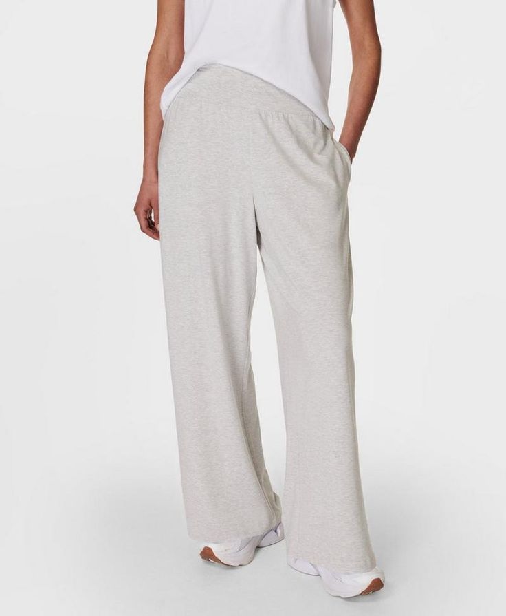 Our super comfortable trousers for everyday activities. Soft, sustainable fabric made from plant-based modal Lenzing™ yarn. Effortless pull on design and a relaxed wide leg fit. Wear high rise or with the wide waistband folded down. Two subtle slip pockets at the hips. Inseam length: 73cm / 23”. Model wears size S and is 178cm/5'10" tall. Style Code: SB8238BColour: Light Grey Marl Wide Leg Bottoms With Pull-on Style For Lounging, Comfy Wide-leg Pants For Spring, Versatile Wide Leg Pull-on Pants For Loungewear, Wide-leg Yoga Pants With Pockets For Loungewear, Comfy Wide-leg Spring Sweatpants, Casual Bottoms With Comfort Waistband For Relaxation, Comfy Wide Leg Sweatpants For Spring, Versatile Full-length Sweatpants For Lounging, Versatile Relaxed Fit Yoga Pants For Lounging