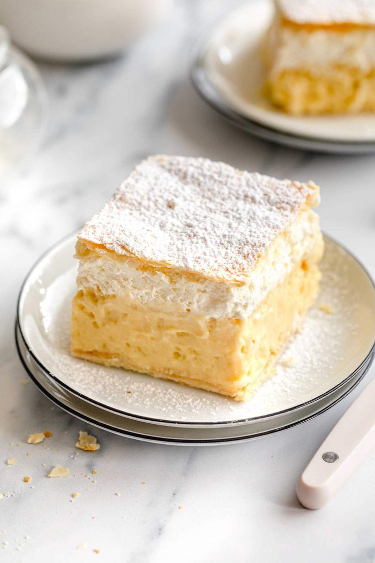 a piece of cake sitting on top of a plate next to a cup and saucer