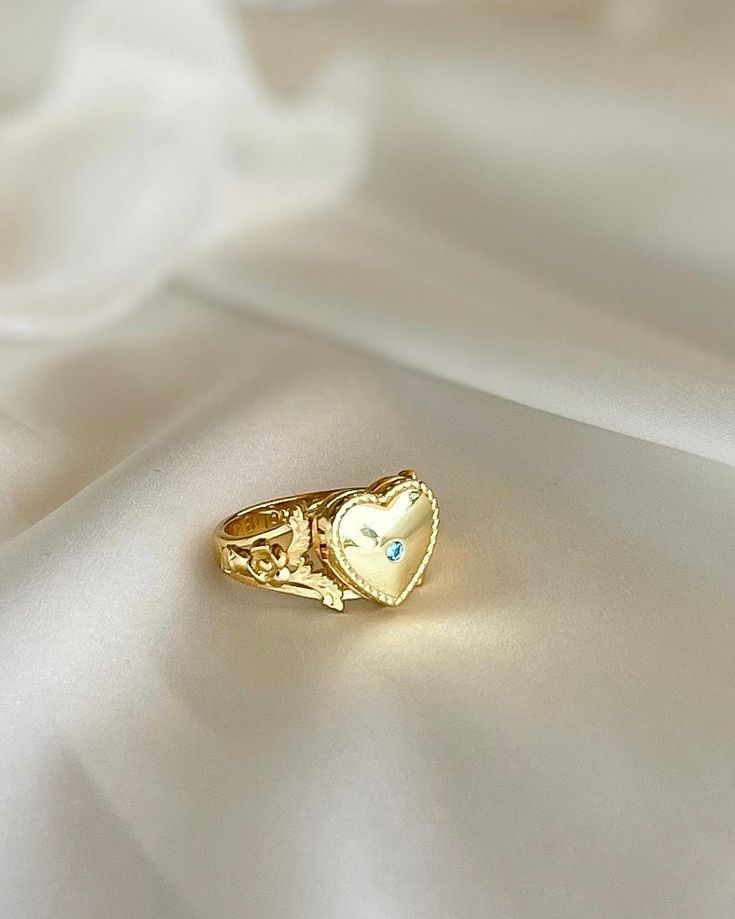 This Heart Locket Ring is crafted from gold plated silver for a luxurious feel and timeless look. Its elegant design is perfect for the special occasions that call for you to make a powerful, romantic statement. Wear it to express love, adoration, or devotion. Elegant Flower Open Ring For Valentine's Day, Elegant Open Flower Ring For Valentine's Day, Gold Plated Promise Ring For Valentine's Day, Valentine's Day Heirloom Ring Jewelry, Heirloom Style Valentine's Day Jewelry Ring, Valentine's Day Heirloom Ring, Gold Plated Round Heart Ring As Gift, Gold Plated Heart Ring For Promise, Gold Crystal Promise Ring, Tarnish Resistant